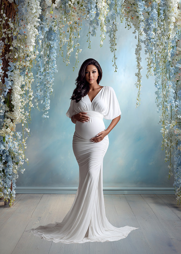 Elegant Blue Floral Arch Backdrop – Cascading White Orchids and Pastel Blossoms with Soft Sky Gradient Wall
