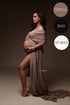pregnant model poses in a studio wearing a draping fabric made of chiffon in espresso color. the scarf is wrapped around her arms. her belly and legs can still be seen while the model poses on her side and looks away. 