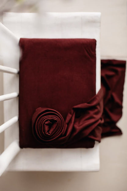 bordeaux backdrop displayed in a studio. 