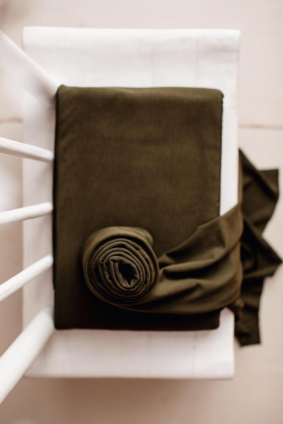 olive backdrop displayed in a studio. 