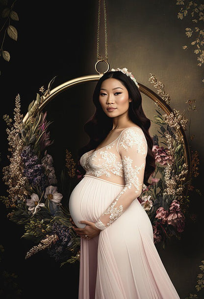 pregnant model poses in a studio in front of a digital background with a golden circle hanging from the floor. the circle is completely full with several flowers.